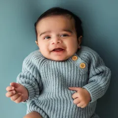 A big, gummy smile from a happy 3-month-old. This age is so special, full of new expressions and reactions that are a joy to photograph.