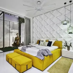A pop of color can transform a space. This vibrant bedroom was designed with a tale of contrast, where a bright yellow bed and sofa stand against a textured white wall, creating an exuberant and joyful atmosphere.