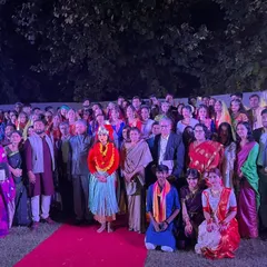 A group photo with performers and dignitaries at a cultural event. My choreography services extend to formal events that require polished and culturally rich performances.