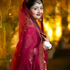 A classic, elegant bridal portrait. The bride's soft smile and the warm, glowing background create a timeless and beautiful image.