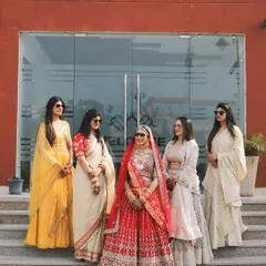 The bride with her squad. A cool, stylish photo of the bride and her bridesmaids, all looking fabulous and ready to celebrate.