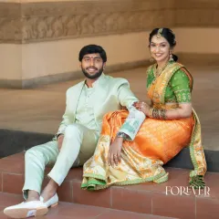 This groom wears a custom-designed mint green bandhgala suit. The clean lines and unexpected color make it a modern statement, perfect for a daytime wedding event or reception.