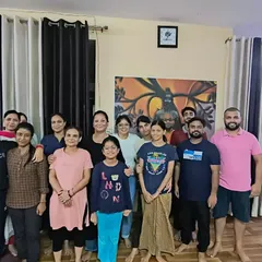 Our yoga community gathered after a meditation session. Practicing together amplifies the sense of peace and shared purpose.