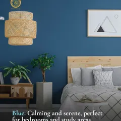 Blue is a naturally calming and serene color, making it an ideal choice for bedrooms and study areas where focus and rest are important. This room pairs a deep blue wall with natural wood and woven textures to create a space that feels both tranquil and grounded.
