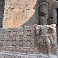A weathered carving on an outer wall of the Kanheri Caves, showing the effects of time on this ancient Buddhist site.