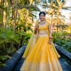 This bride is a vision in yellow. The makeup is kept light and airy to match the daytime destination wedding, with a focus on flawless skin and bright, happy eyes.