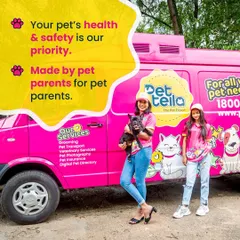 We built this service because we are pet parents first. This photo captures the core of our mission, showing our founders with the iconic pink van that brings trusted grooming and veterinary services to your doorstep.