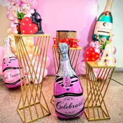 A detail shot of the props used in the bridal shower decor. I used themed elements like "Celebrate" champagne balloons and light-up hearts to add personality and fun to the setup.