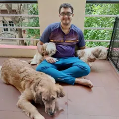 Shreyas enjoying some fresh air on the balcony with a few of our furry guests. The balcony is a safe and secure space for the dogs to relax and enjoy the outdoors.
