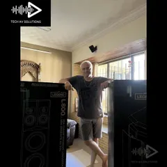This is the moment it all starts. A happy client receiving his brand new Polk Audio Legend L800 floor-standing speakers. The excitement of unboxing high-end audio gear is a feeling I love sharing with my customers.