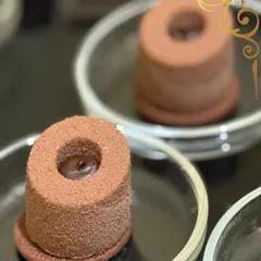 A dessert for the true chocolate lover. This mini chocolate mousse cake has a velvety texture and a rich cocoa flavor, presented simply to let the quality shine.