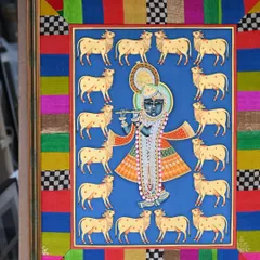 The full view of the custom-framed Pichwai painting. The patchwork border is made from studio offcuts, a sustainable choice that adds a vibrant, modern twist to the traditional Indian art form.