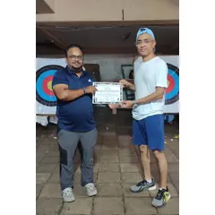An adult student proudly holding his certificate after finishing our 10-day Archery Summer Camp. It’s proof that our camps are a great starting point for all ages.