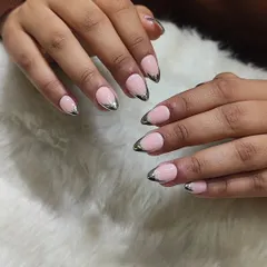 And this is the 'after'! The same hands, now with elegant almond-shaped extensions and a chic pink and chrome French tip design. This is proof that anyone can have their dream nails.