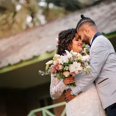 A quiet, intimate moment just after getting married. The couple leans in, foreheads together, soaking in the feeling of being husband and wife.