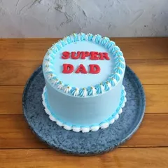 Tell your dad he's a superhero with this "Super Dad" cake. The bold red lettering on a cool blue cake makes a simple and powerful statement for Father's Day.