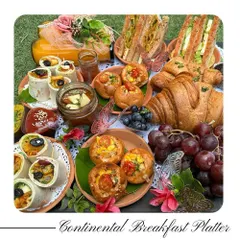 Start your day elegantly with my Continental Breakfast Platter. It features freshly baked croissants, cheese corn buns, grilled sandwiches, a salad in a jar, and fresh juice.
