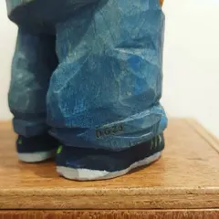The final touches are what make each piece truly personal. Here, you can see a tiny signature I added to the shoe of a figurine, a small detail that adds a unique mark of craftsmanship.