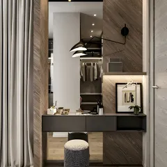 This compact dressing nook is cleverly built into an alcove, featuring a floating vanity, a large mirror, and wood-paneled walls. It shows how any small corner can become a functional space.