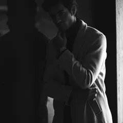 We used shadow and reflection to create this moody and mysterious black and white portrait. This artistic approach is perfect for a model's portfolio, showcasing an ability to convey complex emotions.