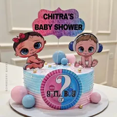 A fun "Girl or Boy?" gender reveal cake with cute baby toppers and a pink and blue color scheme.