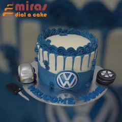 A "Welcome Home" cake for a brand new Volkswagen. This custom cake features the VW logo, a miniature edible car, and a car key, making it a sweet way to celebrate a new ride.