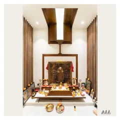 The fully adorned Pooja mandir. We designed this sacred space to be harmonious and Vastu-compliant, using natural materials and focused lighting to create a serene atmosphere for worship.