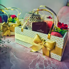 Another angle of the custom gift baskets, showing the Vanilla Gourmand wax melts and a patterned wax warmer. I love helping my clients spread warmth and love.