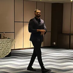 A candid shot of me walking through the event space, ready to engage with guests. For close-up magic, I move around the room, bringing a personal performance to each small group.