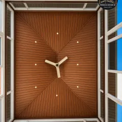 A perfect fusion of form and function. This view from above highlights the sophisticated pyramid ceiling design with a central wooden panel and surrounding glass skylights, flooding the room with controlled natural light.
