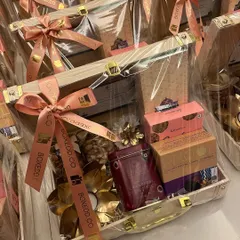 A large batch of our wooden trunk hampers, wrapped and ready for Diwali delivery. This shows our capacity to handle high-volume orders while maintaining a high standard of presentation.