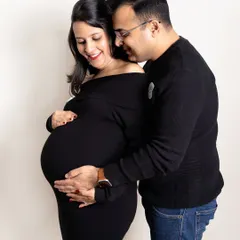 A classic portrait celebrating the beautiful shape of a mother to be. Dressed in timeless black, this couple shares a joyful, loving moment. My studio sessions are perfect for creating these clean, emotion filled images.