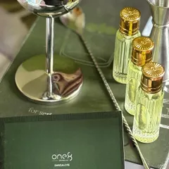 A detailed look at the custom elements for the One8 PR box. This shot highlights the branded cocktail menu and the elegant, fluted glass bottles for the mixers, showcasing our attention to detail in corporate branding.