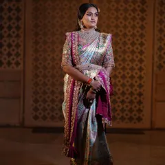 A regal portrait session for a client, featuring a stunning hand-embroidered blouse and a beautiful Kanjeevaram saree. The makeup was designed to give a royal, timeless feel.