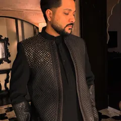 'Halka Halka Suroor'. A stylish look in a custom-designed black textured jacket, perfect for a modern performance.