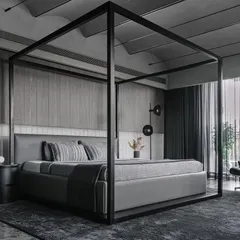 In this master bedroom from the Vaulted Haus, we used a four-poster bed to define the volume within the larger space. The headboard wall is a study in texture, combining frosted glass bricks with custom grey veneer strips. This layering of materials, along with the vaulted ceiling and tensioned rope lighting, creates a serene and sophisticated sanctuary.