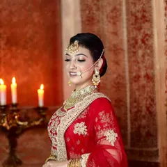 The complete bridal vision. This photo showcases how the makeup, hair, and dupatta setting come together to create a cohesive and royal North Indian bridal look.