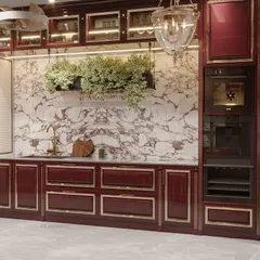 We transformed this culinary space into a masterpiece with a stunning maroon color palette. The classical design, featuring an arched cooking niche and book-matched marble, brings a timeless charm that is both functional and stylish.