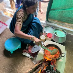 A woman from the Marko family cooking a delicious meal for our group on a traditional wood-fired stove. The taste of food cooked with such love and care is something you will never forget.