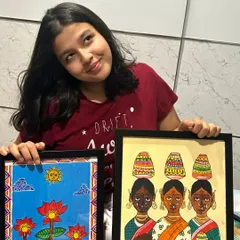 Here is one of our senior students, Adhya from the 11th standard, proudly showing her completed Madhubani paintings. We guide older students in advanced techniques like acrylics on canvas to create professional-quality folk art.