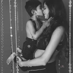 A mother's love captured in a timeless black and white photo. The bond between this mom and her son is so clear in this sweet, cuddly moment.