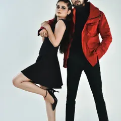 A full-length studio portrait for a couple's fashion shoot. I created coordinated looks with the female model featuring a sharp winged eyeliner and the male model styled for a clean, camera-ready appearance, showcasing my versatility for both male and female portfolio makeup.