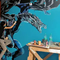 Painting the icy dragon Viserion for the Game of Thrones themed pub, Westeros. This was part of a massive 45 foot wall, and we loved getting all the details right.