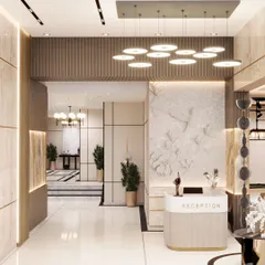 A reception area that makes a statement with a custom floral bas-relief wall and elegant lighting. This space is designed to provide a luxurious and memorable welcome.