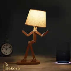 Our Wooden Robot Lamp is a customer favorite for its unique and interactive design. Handcrafted from wood with adjustable joints, it serves as both a functional desk light and a delightful decorative object.