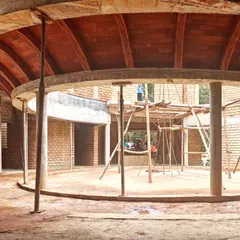 A brick vault under construction. This image captures the raw beauty of the building process, showing the structural logic and inherent texture of arched masonry before the final finishes are applied.