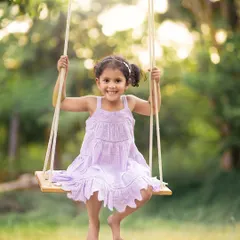 Another beautiful moment from our outdoor swing session. The soft, backlit glow of the golden hour makes these portraits feel truly magical.