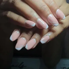 I love the intricate detailing on these gorgeous pastel French nails. The abstract white lines give this classic look a very modern and artistic feel.