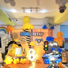 A double celebration for Sraj and Stav with a construction and Hot Wheels theme! We combined a digger cutout with a sleek race car and traffic light for a party that was all about fun on wheels.