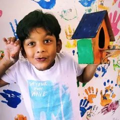 This camper is all smiles with his colorful, custom-painted birdhouse. We love seeing the unique creativity each child brings to their project.